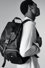 Placeholder for: Man wearing black nylon backpack