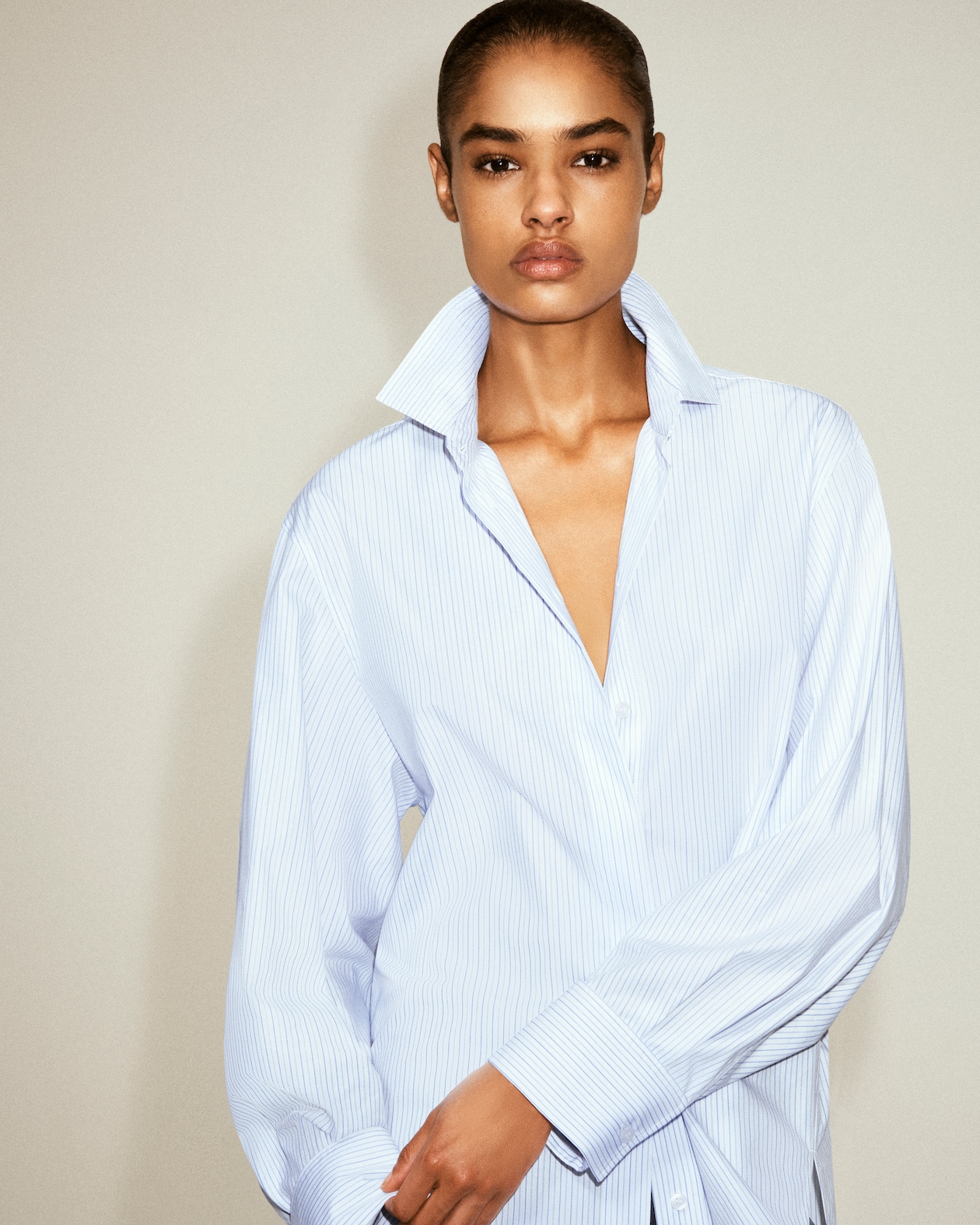 Model in Striped button up shirt