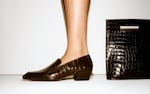 Placeholder for: Women in snake skin shoe and bag