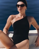Placeholder for: woman in asymmetric black swimsuit