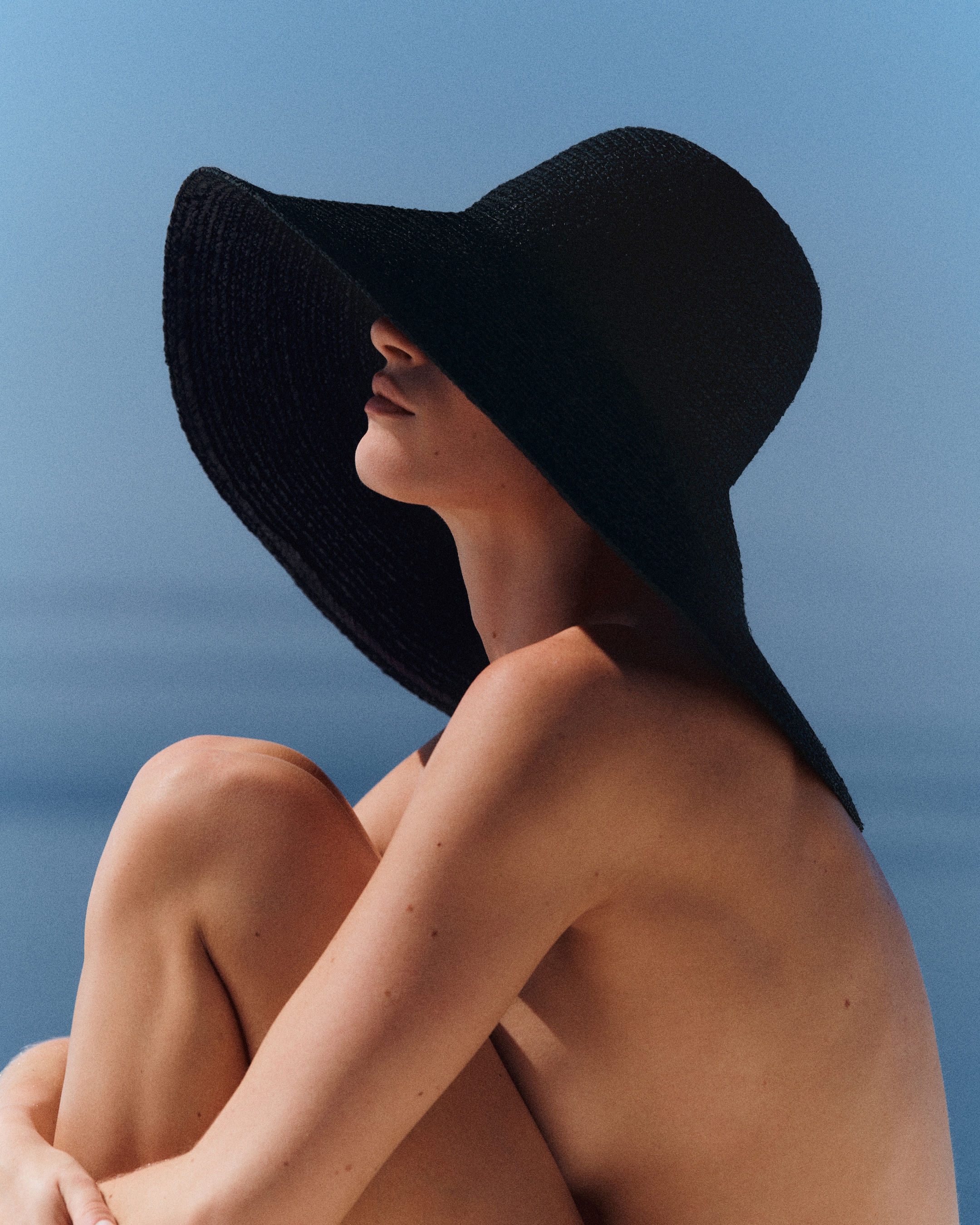 woman in black straw hat