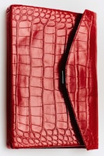 Placeholder for: A red crocodile pattern leather envelope clutch with a sleek, shiny finish.