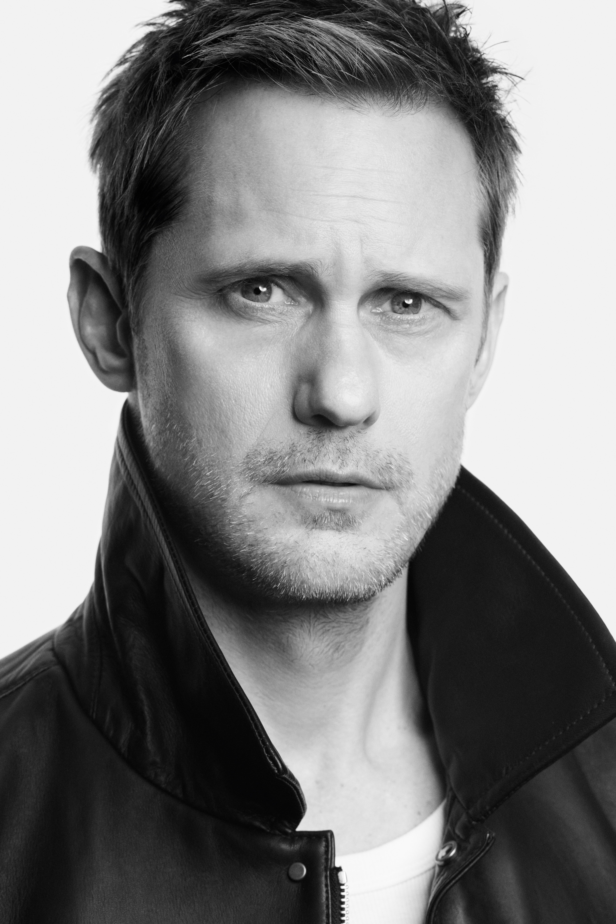 Person wearing black leather jacket