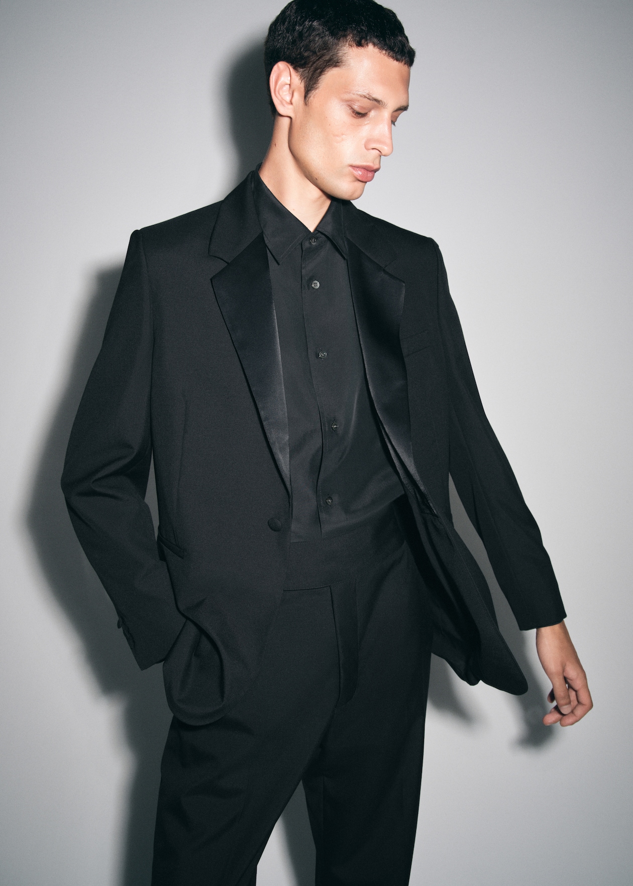 mens black full suit with black shirt and sating blazer