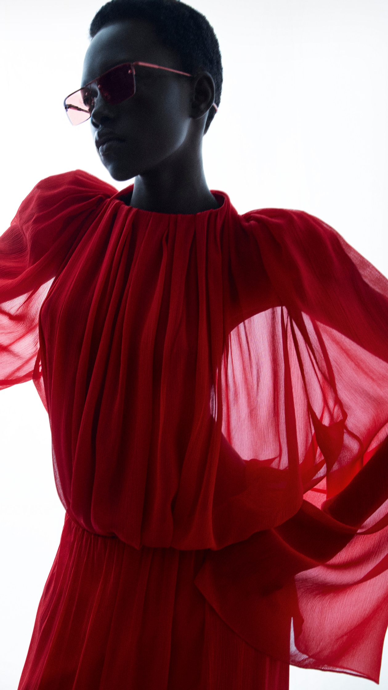Person wearing womens red dress