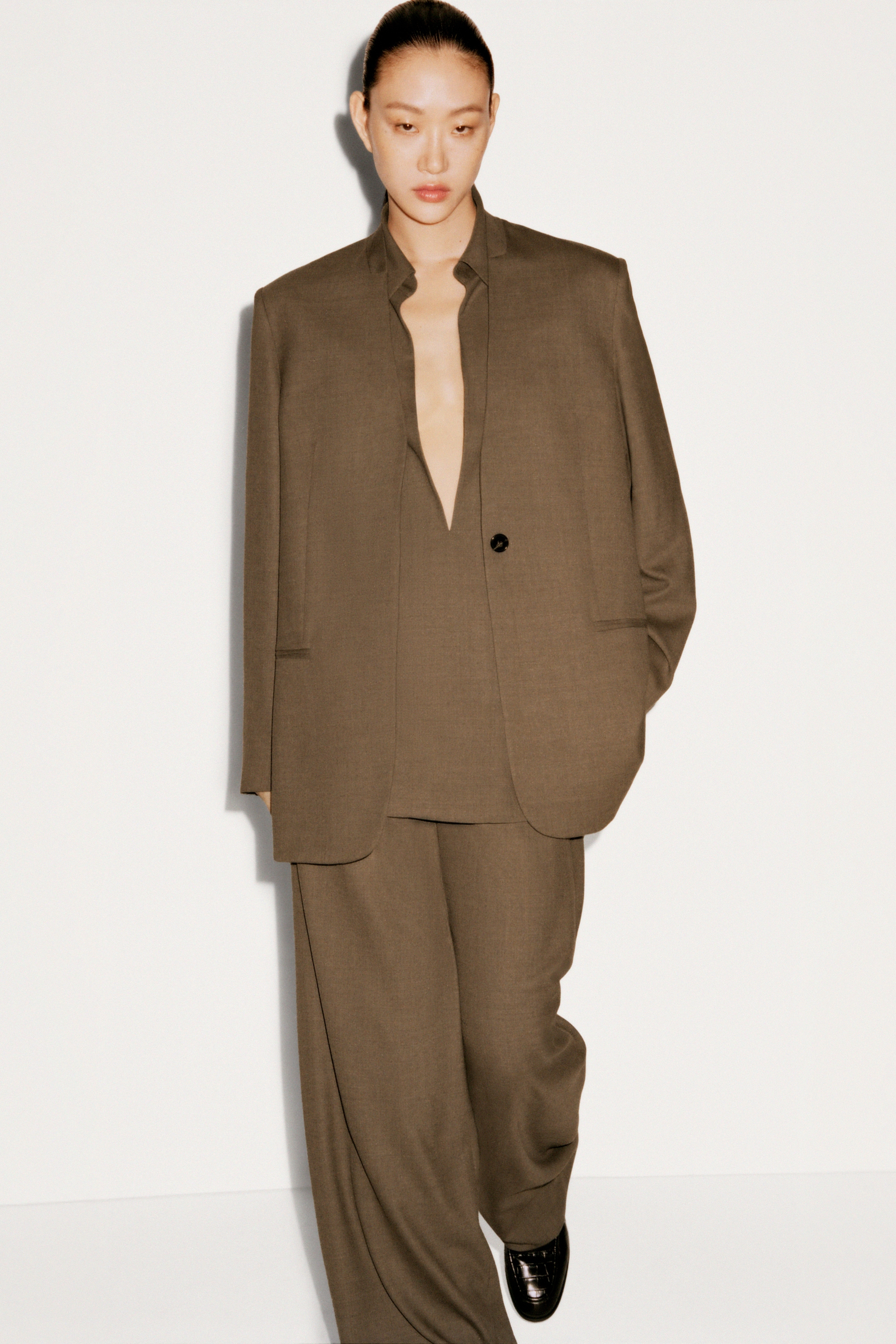 Women in full olive suit