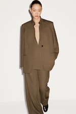 Placeholder for: Women in full olive suit