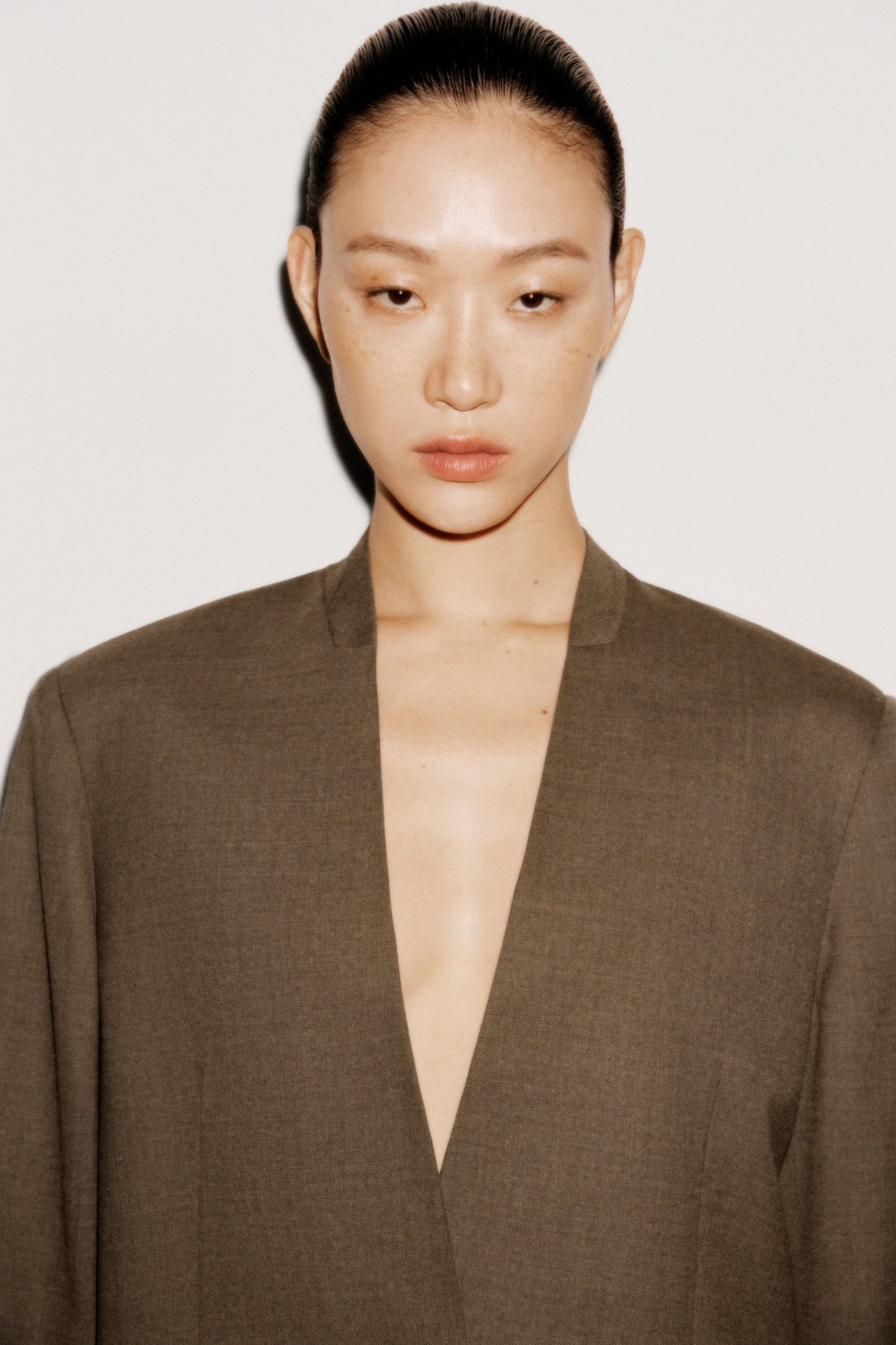 Women in an olive suit