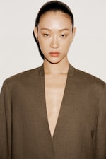 Placeholder for: Women in an olive suit