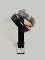 Placeholder for: A twisted black leather belt with a shiny rectangular silver buckle, displayed against a plain light background.