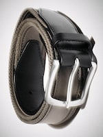 Placeholder for: Rolled beige and black leather belt with silver buckle, showcasing the texture of the belt and sleek design of the buckle.