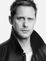 Placeholder for: Black and white portrait of a man with short hair, wearing a leather jacket with the collar up, looking directly at the camera against a plain background.