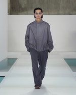 Placeholder for: grey leather jacket and grey trousers