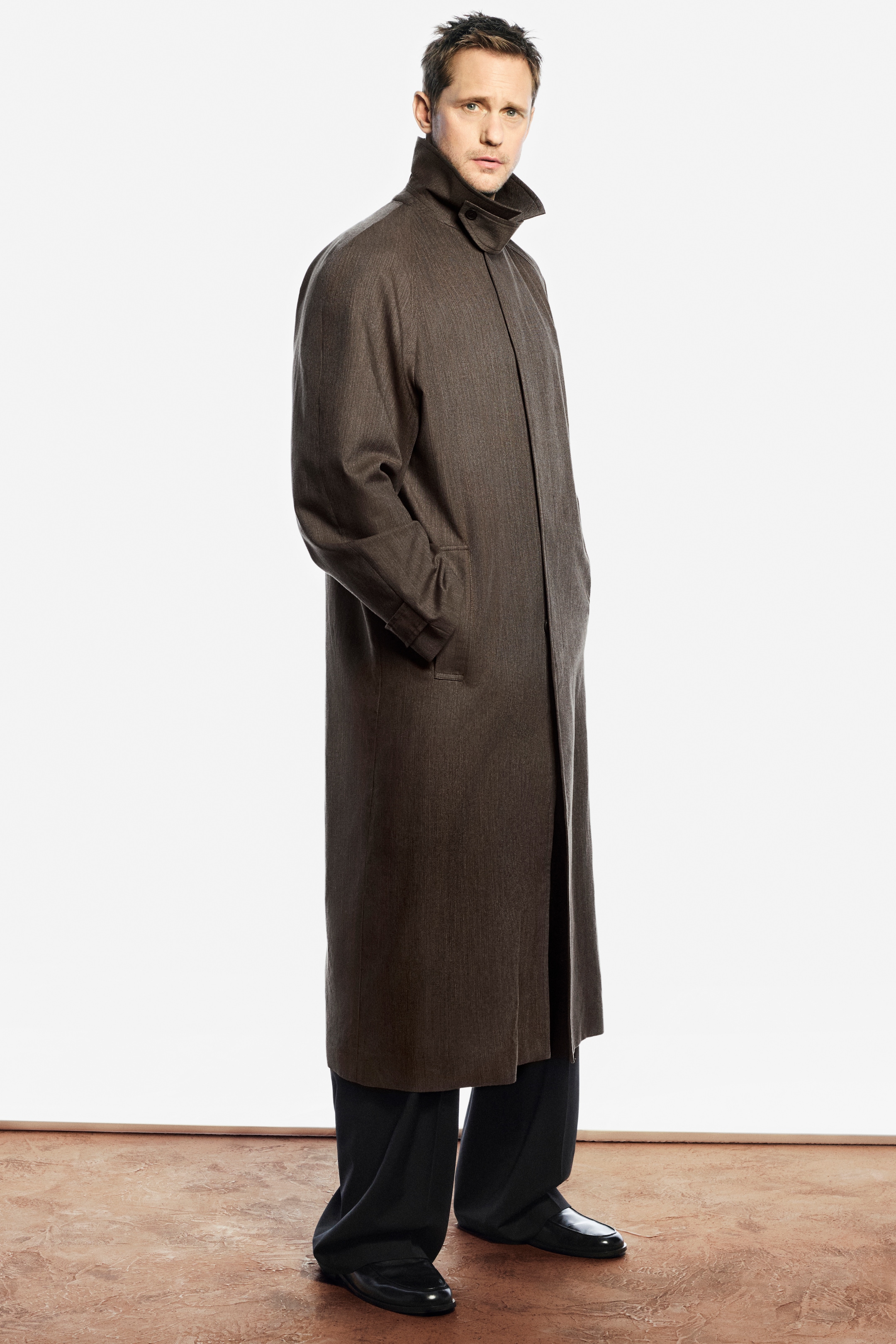 Person wearing brown coat