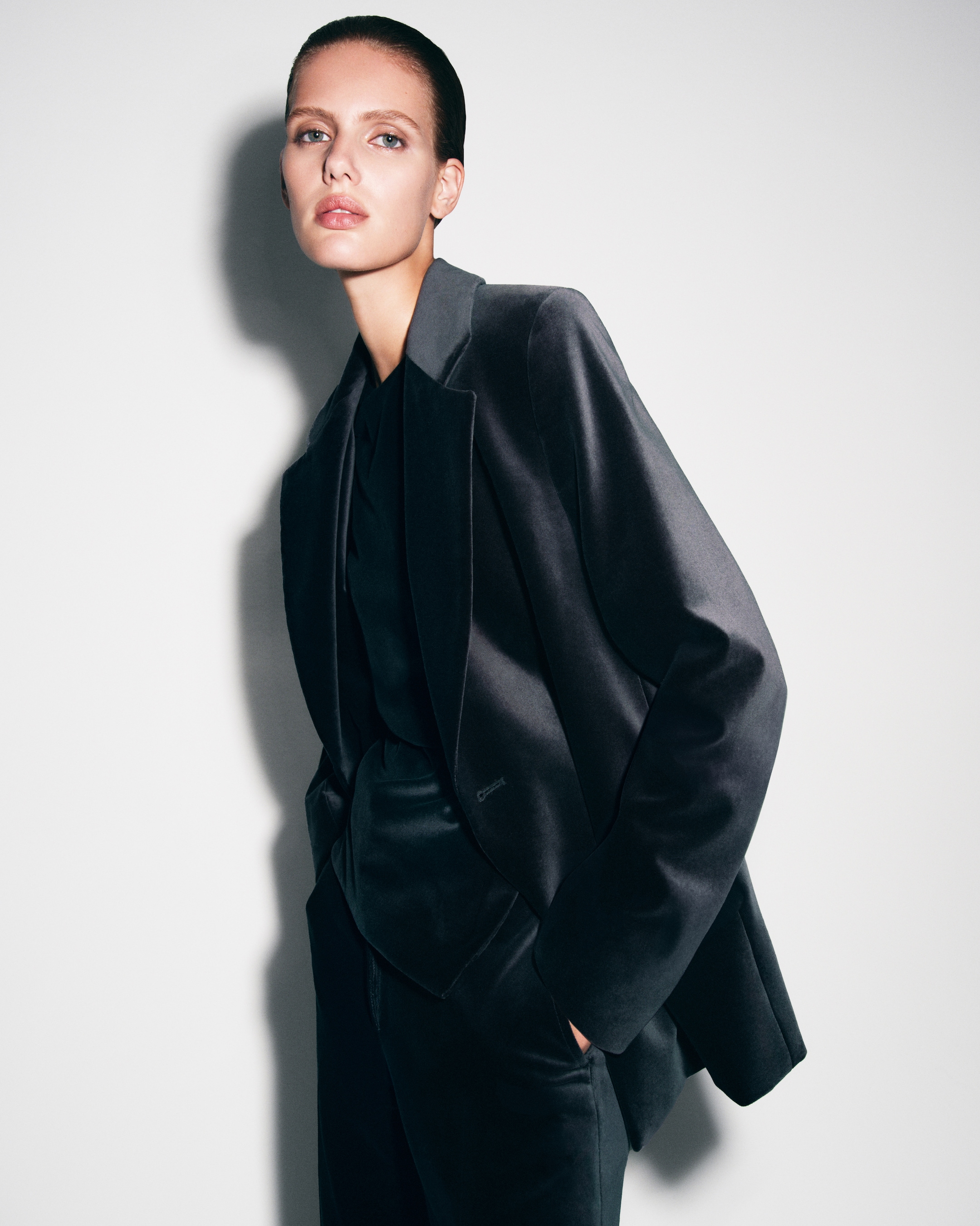 Person wearing black velvet suit