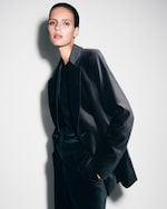 Placeholder for: Person wearing black velvet suit