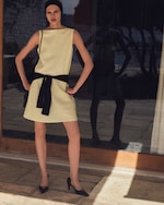 Placeholder for: yellow dress with a jumper knotted at waist