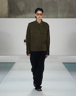 Placeholder for: brown suede jacket and black trousers