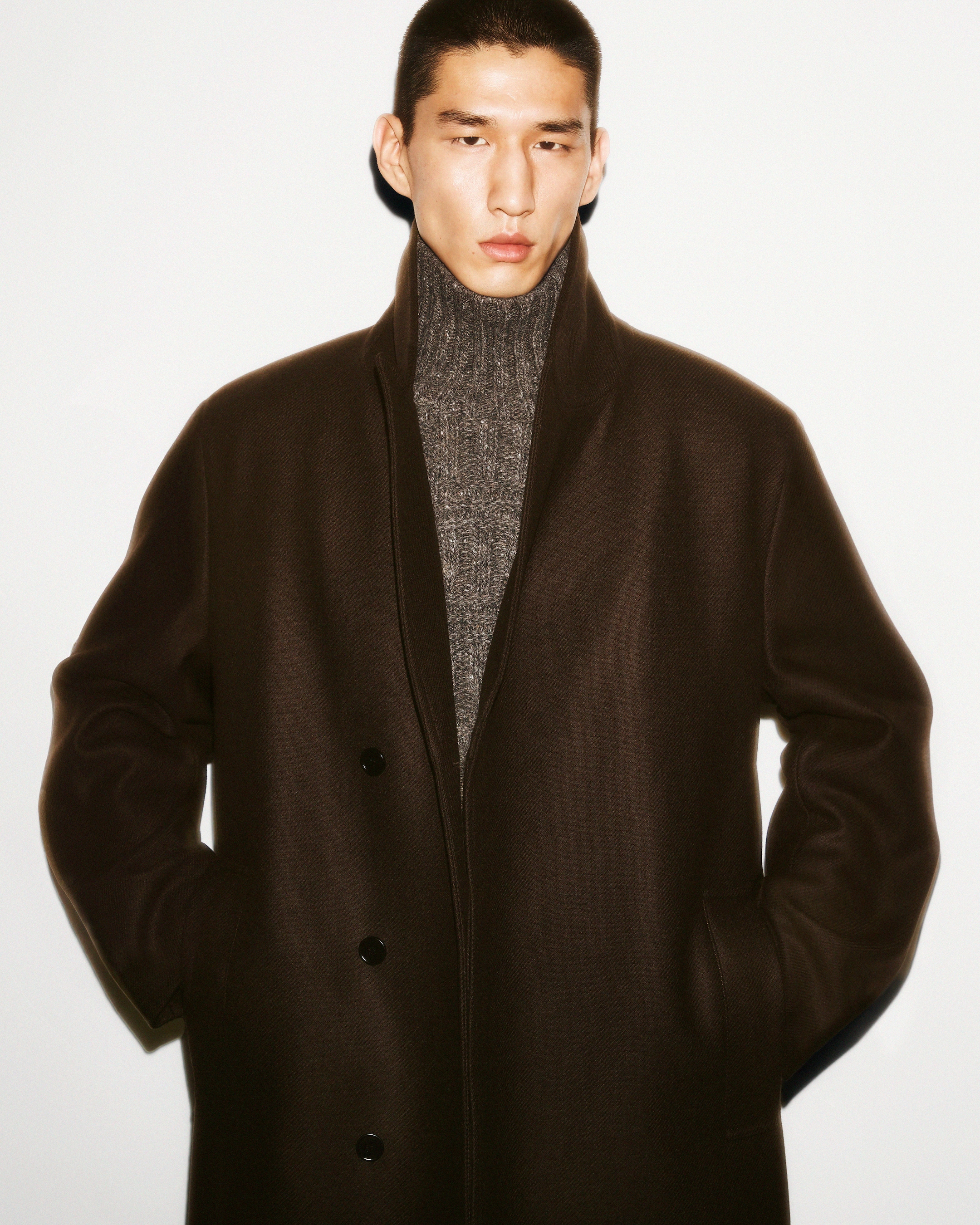 Man in jacket with wool roll up