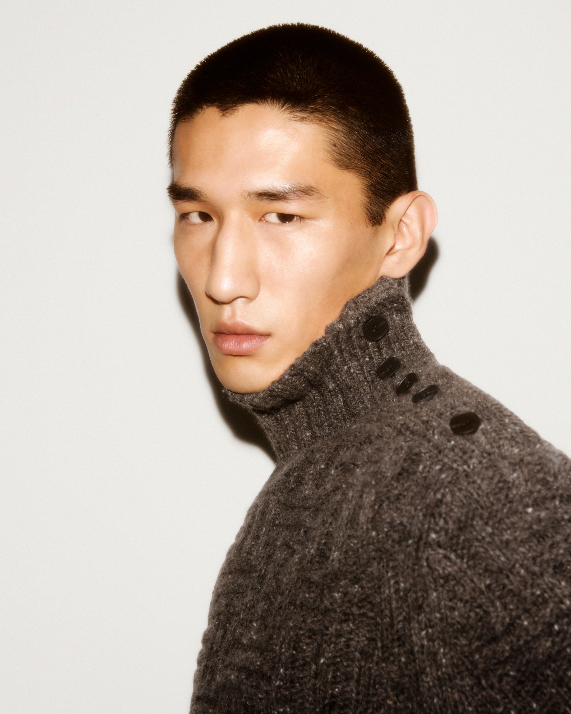 Knitwear man with buttons on the collar
