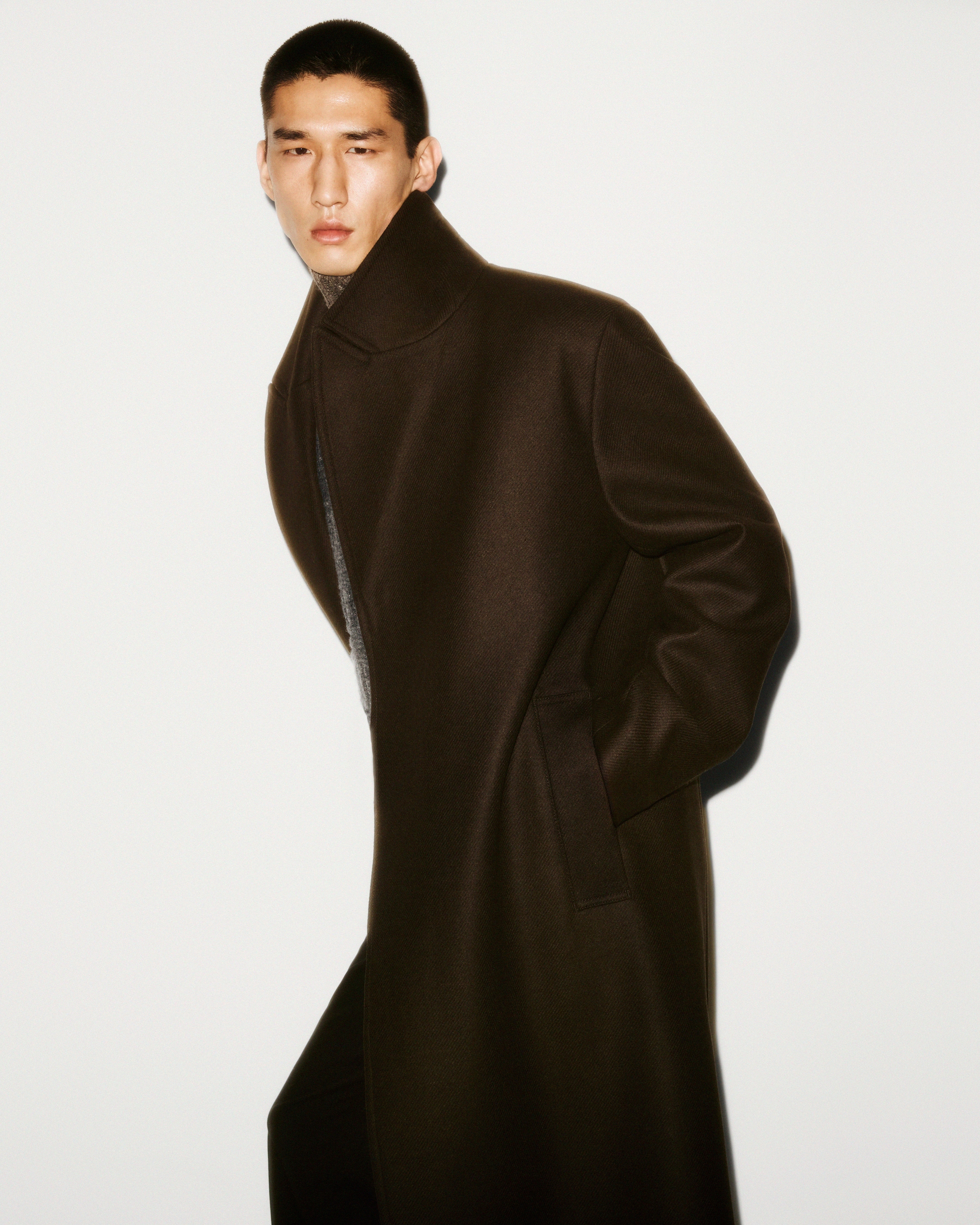 Person wearing brown coat