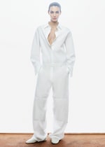 Placeholder for: woman in white trousers and shirt