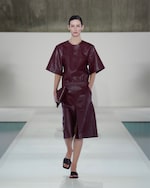 Placeholder for: woman in red leather top and skirt