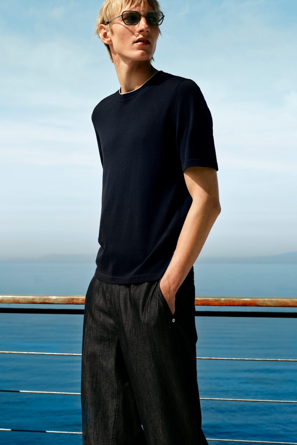 person wearing a navy t-shirt