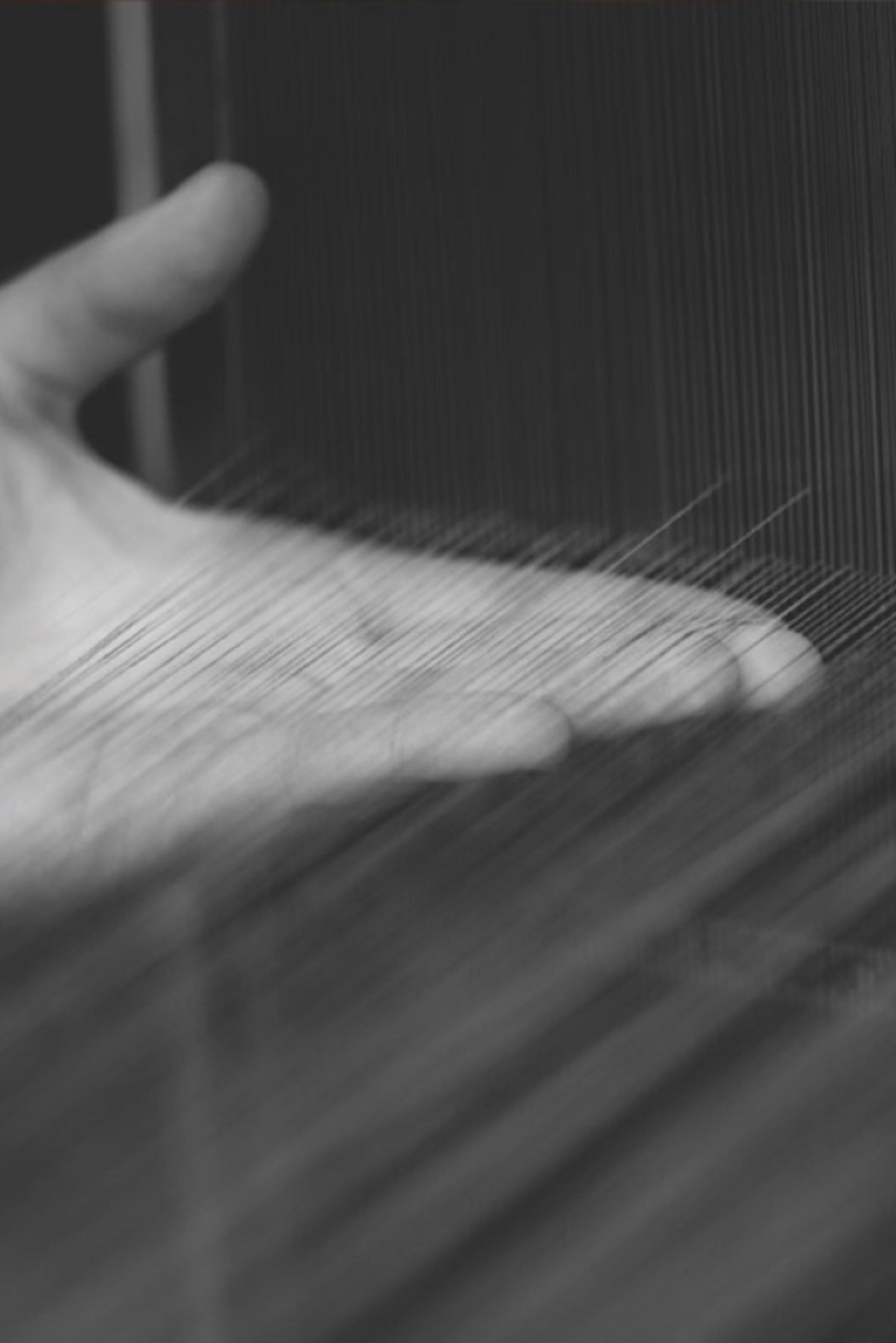 Hand holding thread