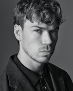 Placeholder for: Man wears black shirt under wool coat