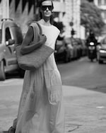 Placeholder for: Women with straw tote bag