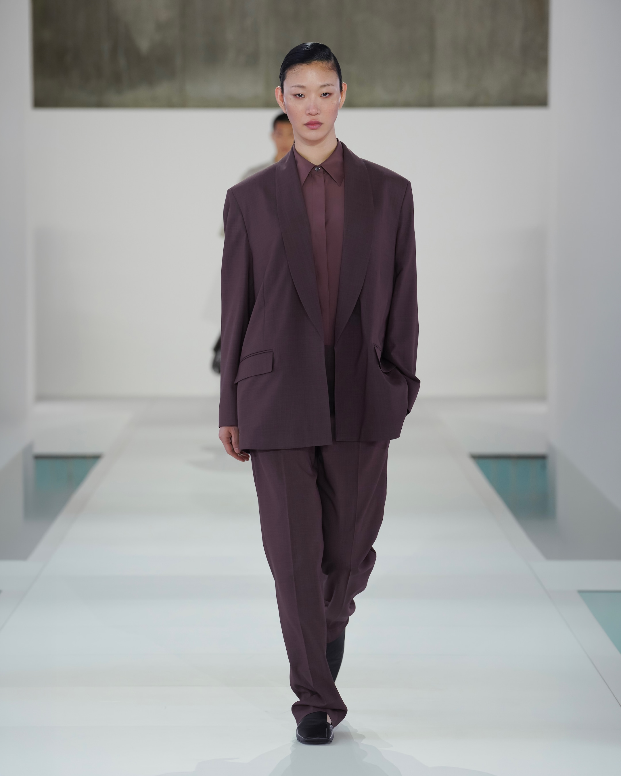 woman in burgundy suit