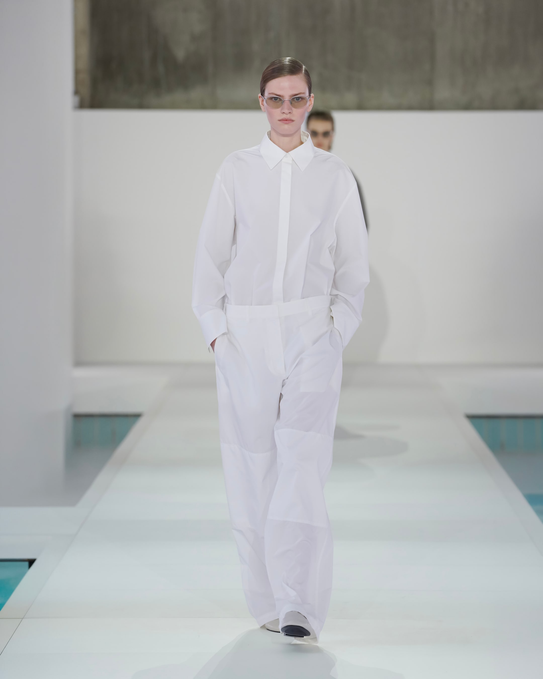 woman in white shirt and white trousers