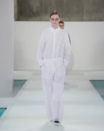 Placeholder for: woman in white shirt and white trousers