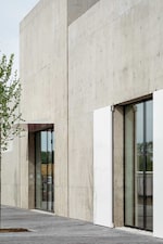 Placeholder for: Cos store building in concrete