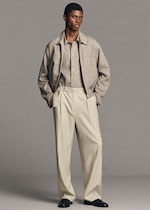 Placeholder for: man wearing linen zip up blouson and linen shirt