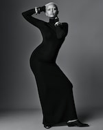 Placeholder for: Woman wears black dress and silver bangles