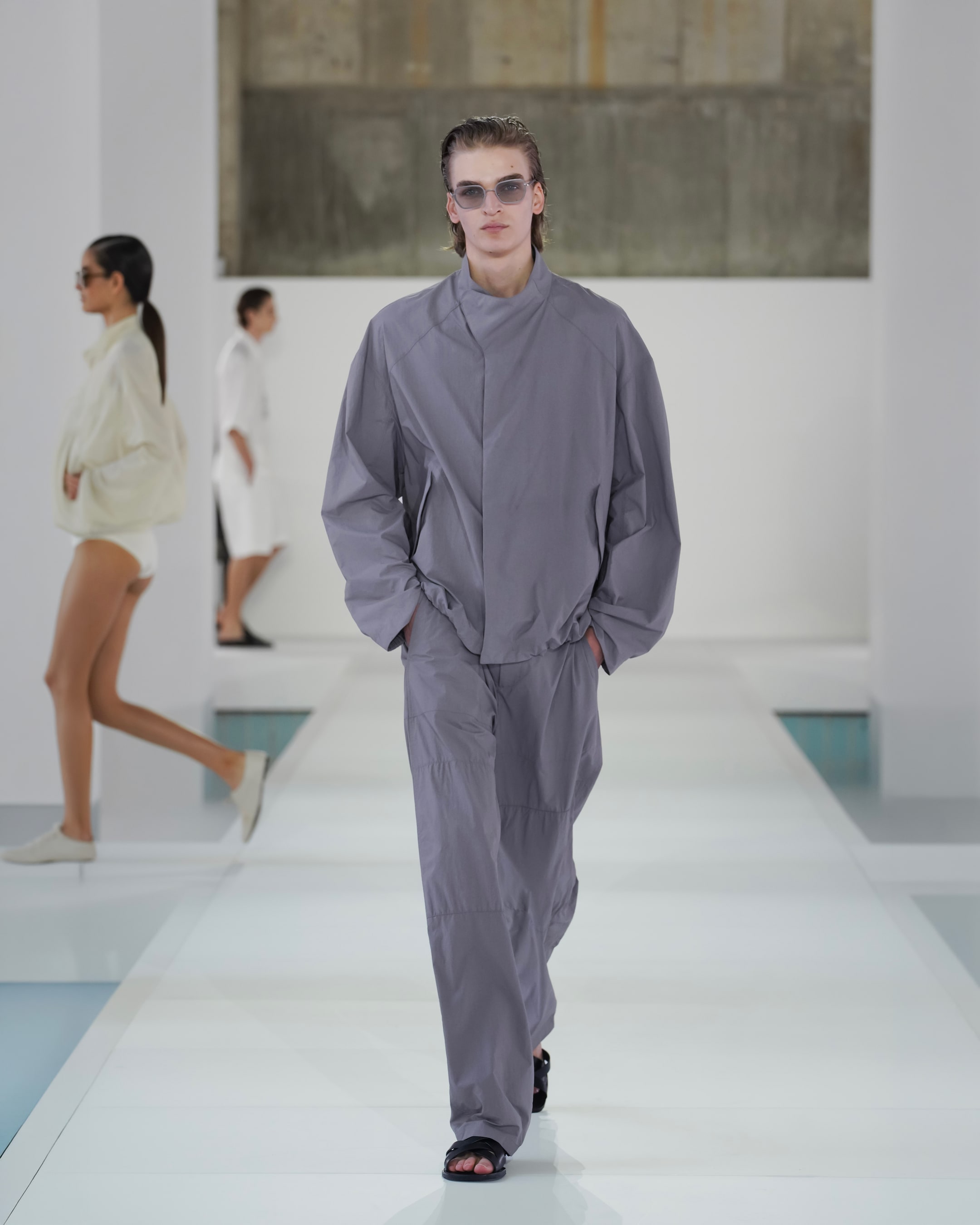 grey nylon jacket and barrel trousers