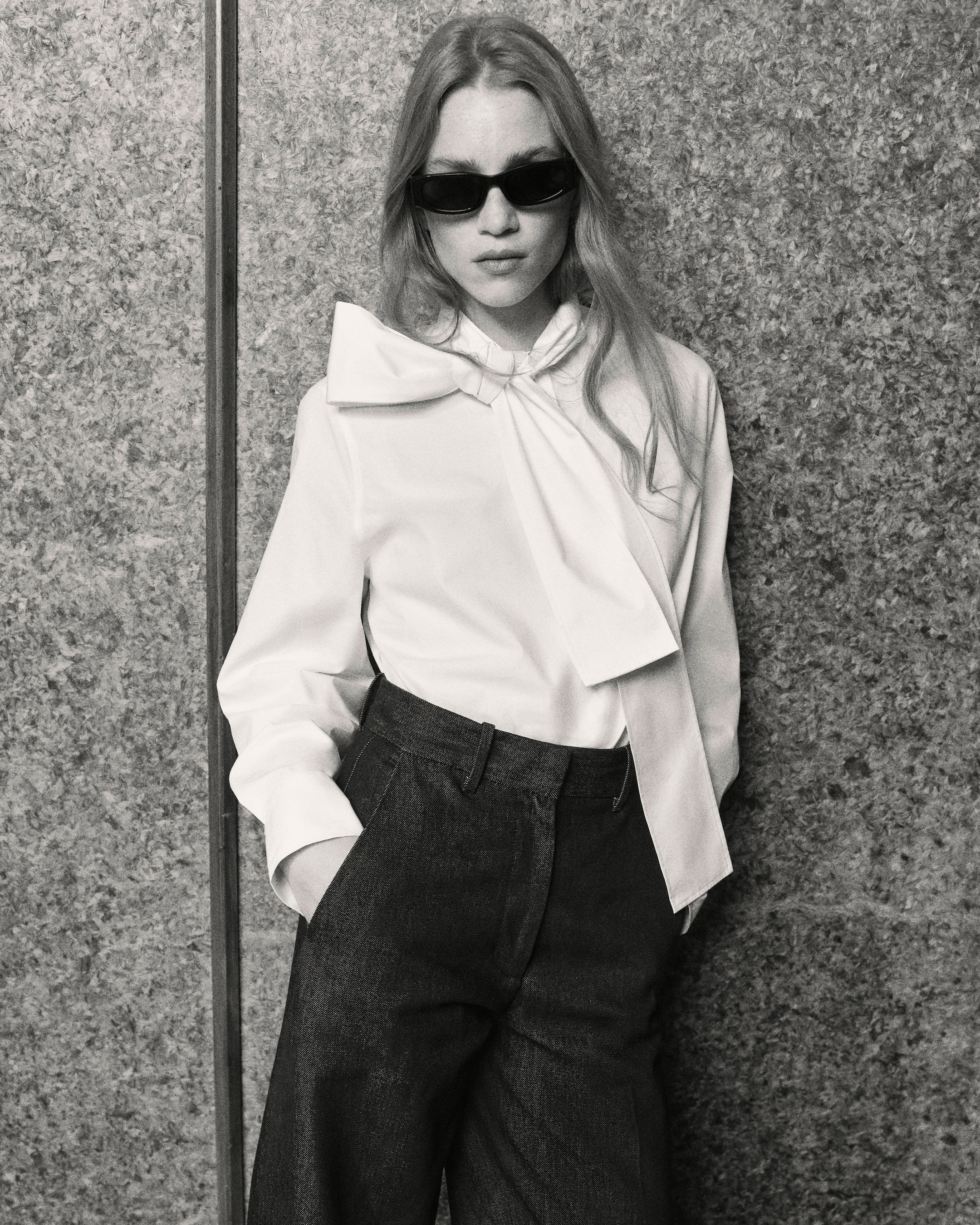 Woman in sunglasses and white blouse