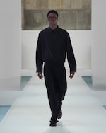 Placeholder for: Black silk shirt and black trousers