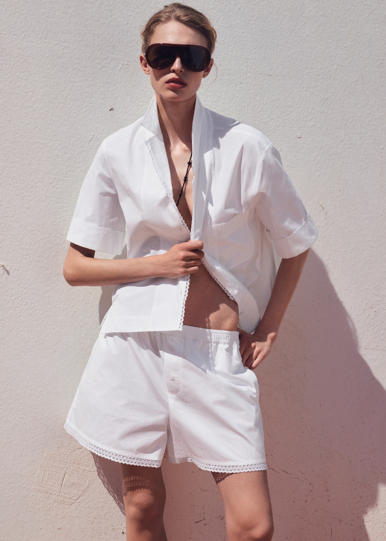 Women in White summer set with trendy sunglasses