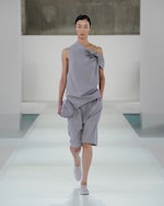 Placeholder for: woman in grey top and shorts