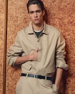 Placeholder for: man in coordinating beige shirt and trousers with belt