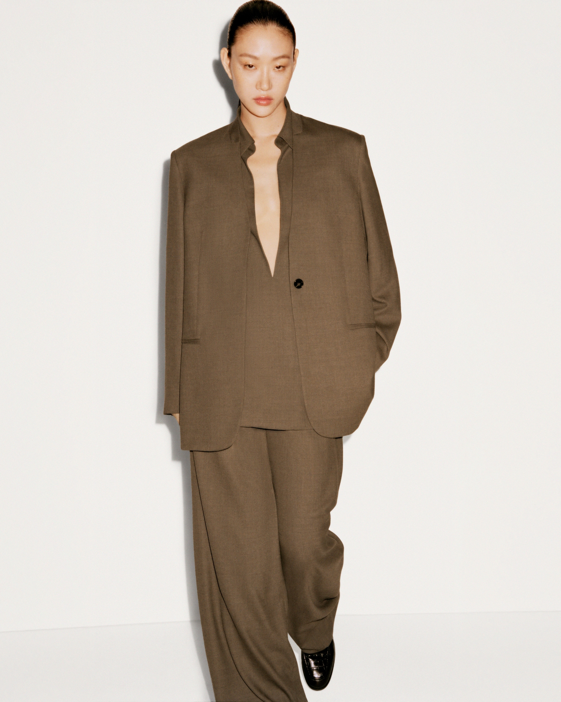 person wearing brown suit