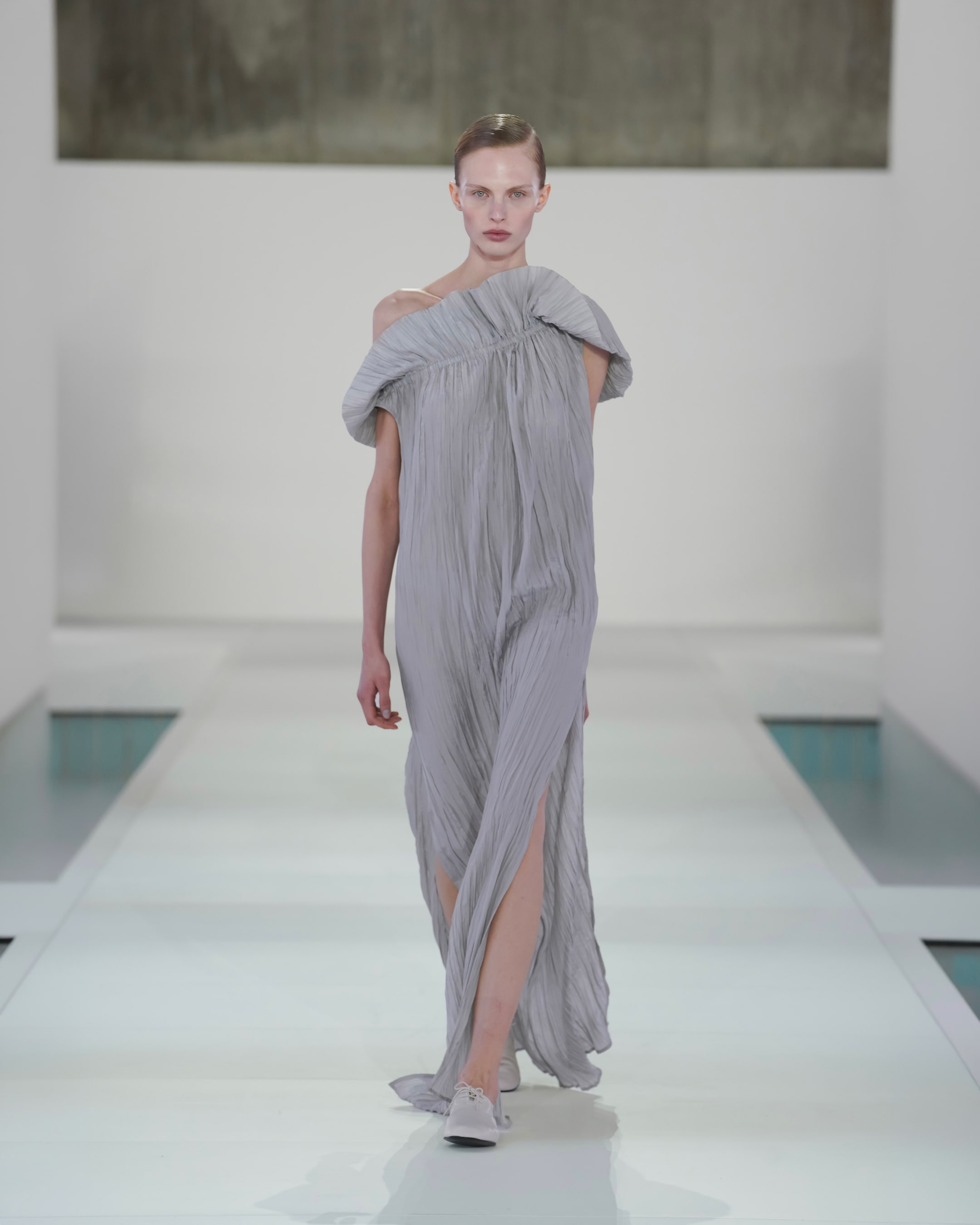 woman in pleated dress