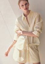 Placeholder for: woman in yellow striped shirt and matching shorts