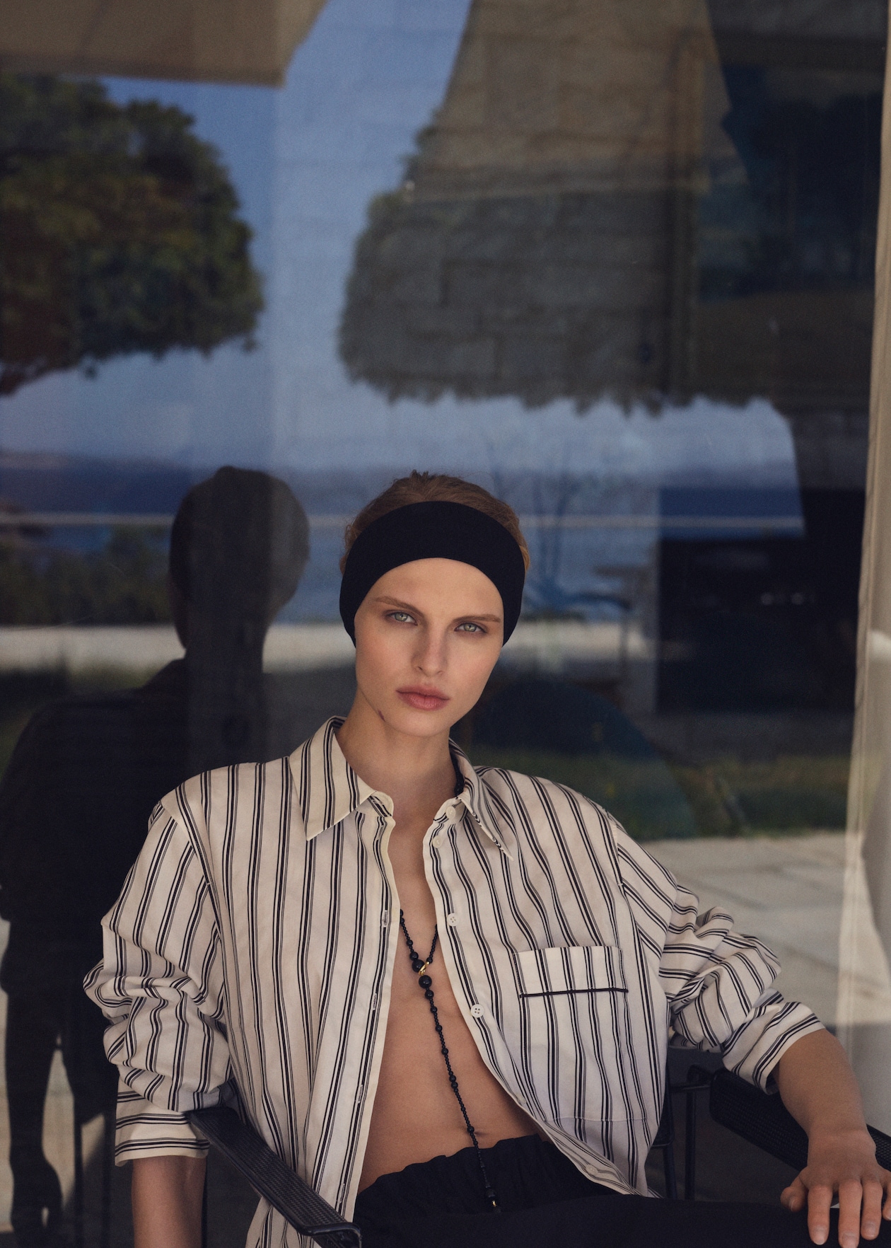 woman in striped shirt and black skirt