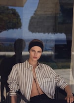 Placeholder for: woman in striped shirt and black skirt