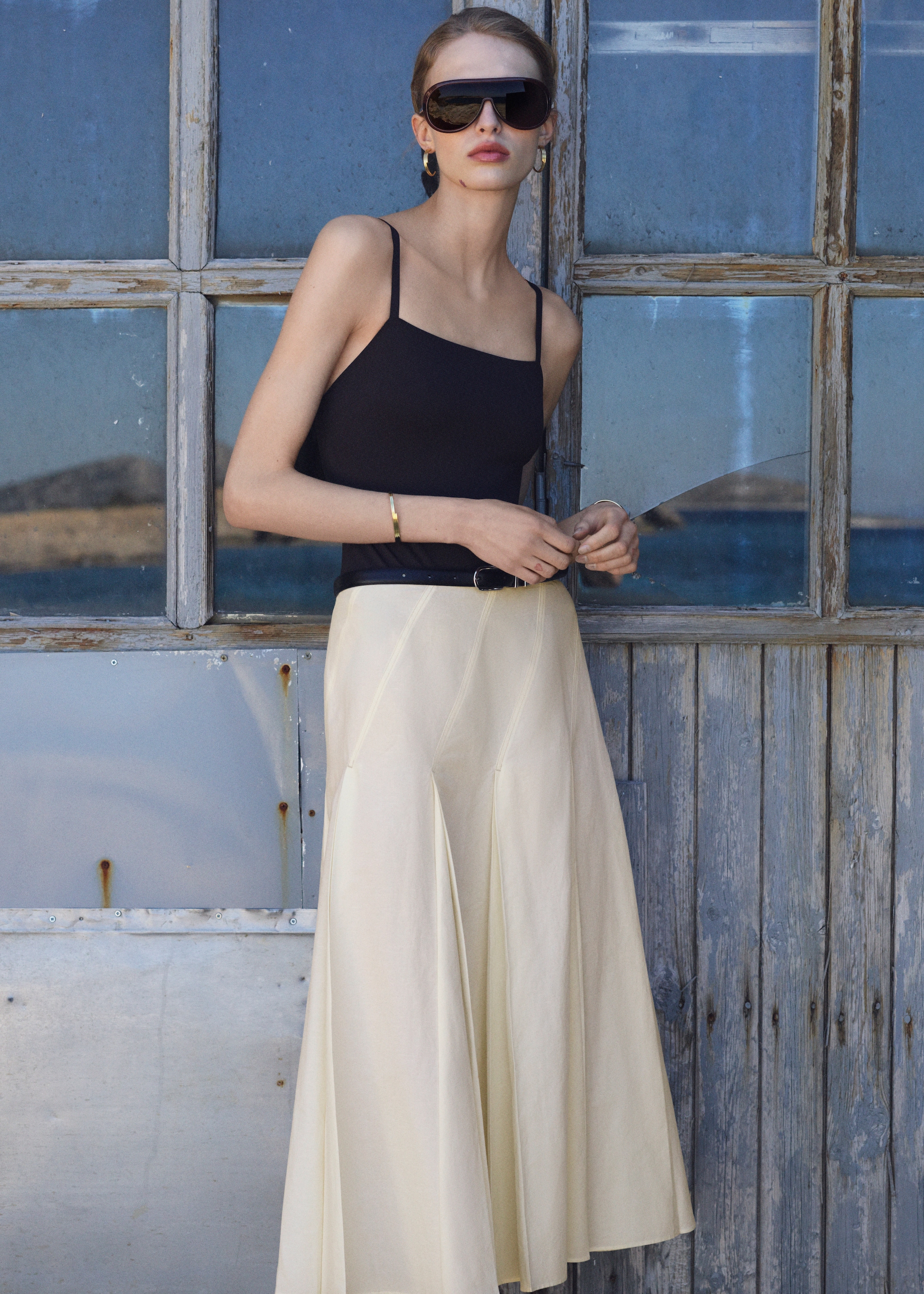 woman in tank top and white skirt