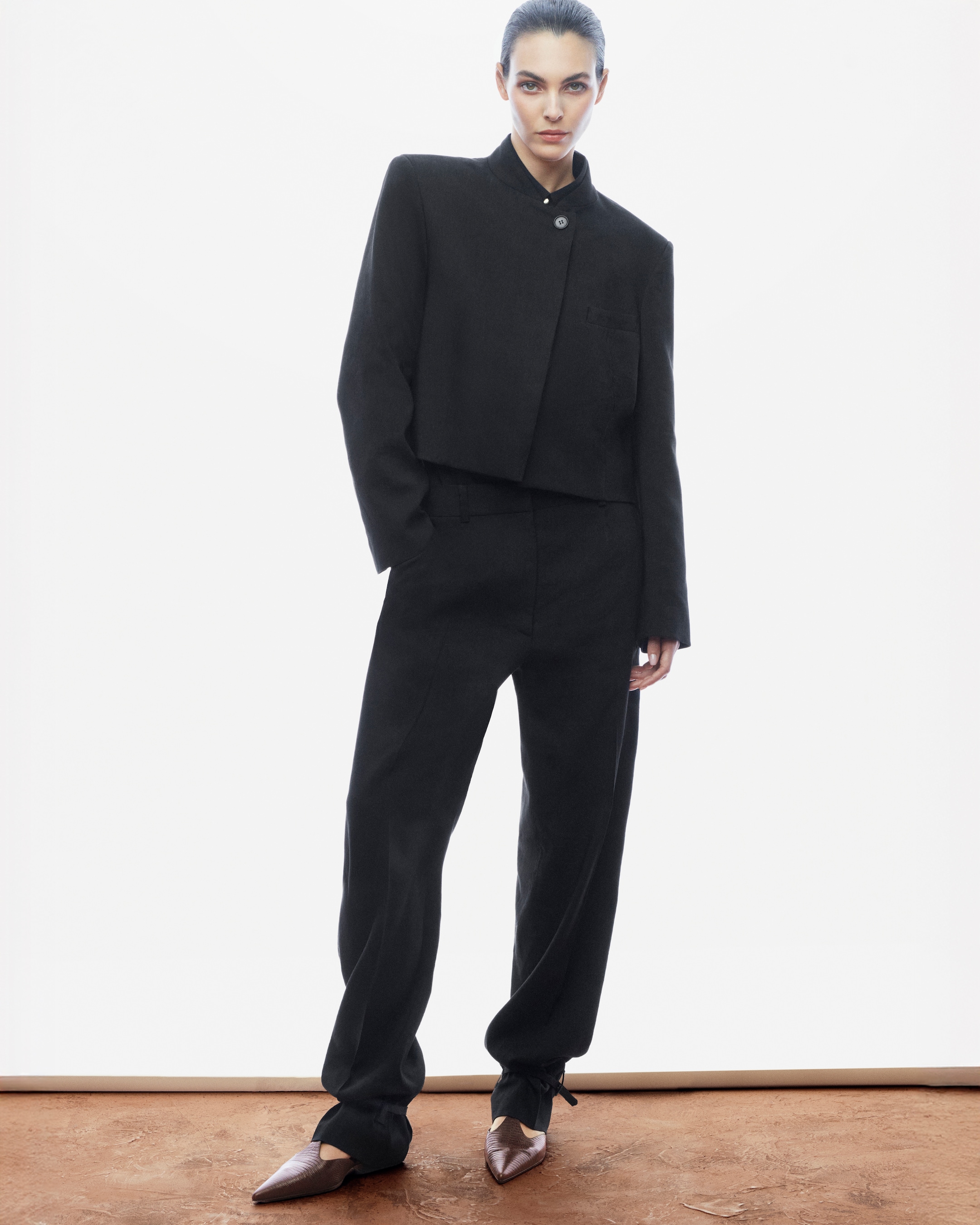 woman in black linen suit